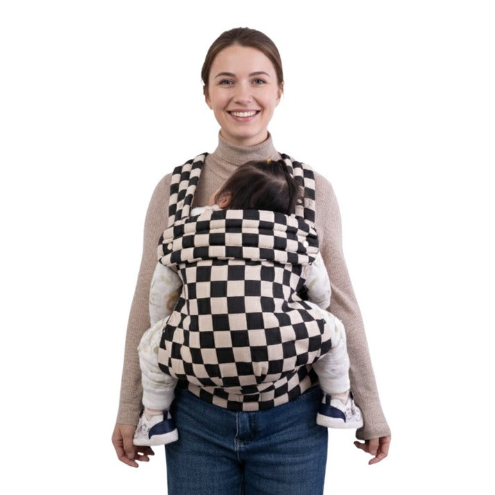 JollyBoo mom holding her baby with checker newborn carrier 
