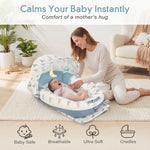 Mother soothing newborn baby in JollyBoo blue elephant infant lounger with canopy, breathable ultra soft baby nest pillow