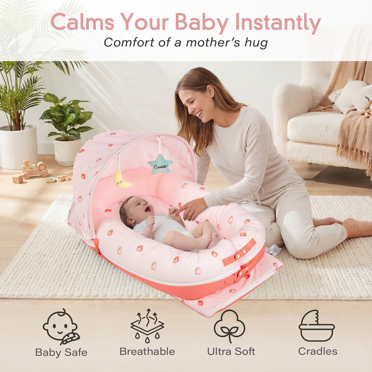 Mother and newborn in JollyBoo pink lounger bonding and family time