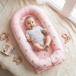 newborn in JollyBoo pink strawberry infant lounger, lounger for newborn baby nest pillow