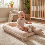 baby playing in adjustable baby lounger pillow for newborn and extandable