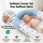 baby sleeping in a breathable baby lounger for newborn made with a buttery-soft washable bamboo and cotton blend.